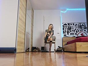 Glamorous blonde in short hair struts high heels