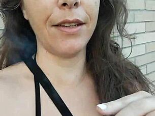 Kelly Kendricks Smokes Cigarettes In The Sun With Lots Of Cleavage