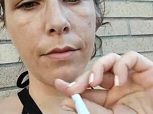 Kelly Kendricks Smokes Cigarettes In The Sun With Lots Of Cleavage