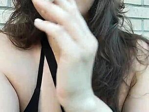 Kelly Kendricks Smokes Cigarettes In The Sun With Lots Of Cleavage