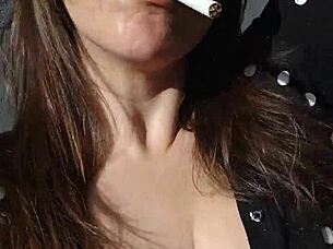 Kelly Kendricks Smokes Cigarettes In The Sun With Lots Of Cleavage