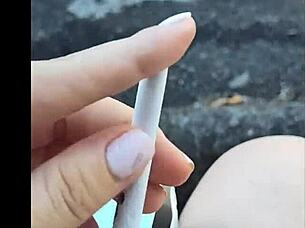 Kelly Kendricks Smokes Cigarettes In The Sun With Lots Of Cleavage