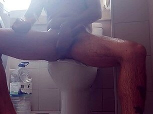 This guy was shaving his monster cock when he suddenly spit out a ton of milk everywhere