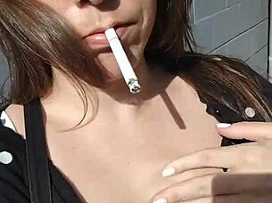 Kelly Kendricks Smokes Cigarettes In The Sun With Lots Of Cleavage