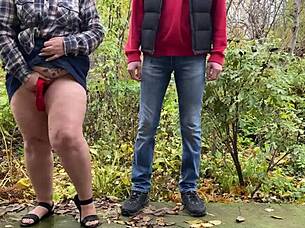 mature woman in lingerie teases with her curvy belly and legs to draw attention