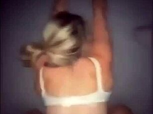 The blonde appears in a simple scene.