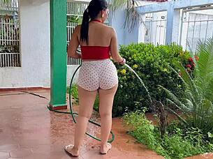 Milf Babe Shows Huge Ass Watering Plants in Shorts