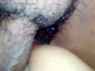 An amateur couple engages in a position from behind during their intimate time.