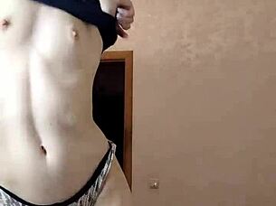 A beautiful woman dances and plays for the camera in a solo webcam session.