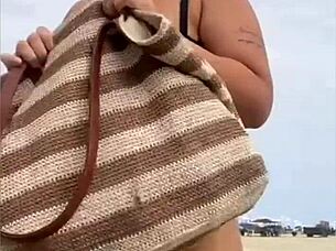 Wearing A Tight Yellow Bikini That Splits The Pussy To Attract Attention On The Beach