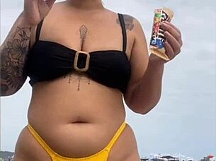 Wearing A Tight Yellow Bikini That Splits The Pussy To Attract Attention On The Beach