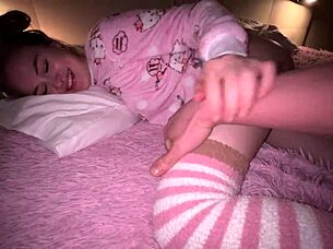 young woman shares a bed with her friend during an unexpected stay