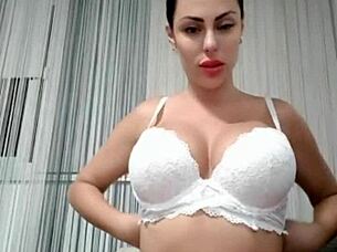 Brunette with big tits has an orgasm with huge dildo moaning loudly while masturbating solo naked