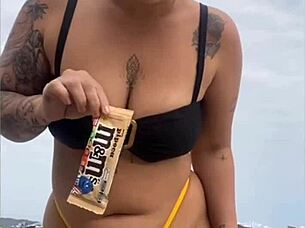 Wearing A Tight Yellow Bikini That Splits The Pussy To Attract Attention On The Beach