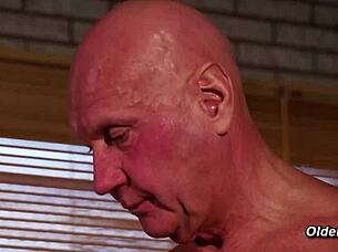 Hey, check out this old grandpa giving a massage to a stunning blonde teen before they get into bent over fucking!