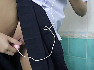 the horny thai student fists her tight pussy in the steamy bathroom solo
