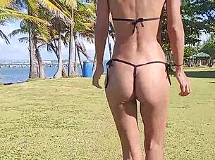 Skinny latina strips teases flashes at public beach