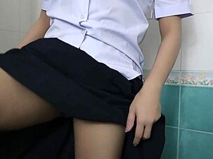 the horny thai student fists her tight pussy in the steamy bathroom solo