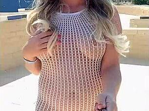 blonde flashes big tits in transparent dress outdoors