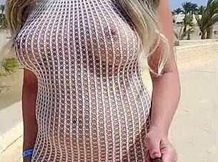 blonde flashes big tits in transparent dress outdoors