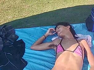 Skinny latina strips teases flashes at public beach