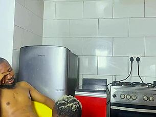 Ebony employee surprises boss in kitchen grabbing attention