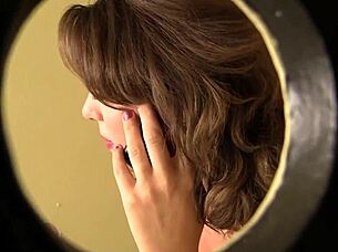 ashley coda moans sucking cock through gloryhole in bathroom