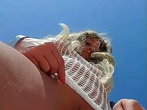 blonde flashes big tits in transparent dress outdoors