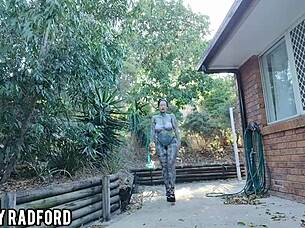 Curvy woman tries bikinis during outdoor walk