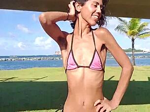 Skinny latina strips teases flashes at public beach