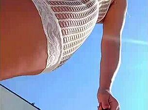 blonde flashes big tits in transparent dress outdoors