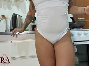 Curvy tanned Brazilian neighbor cooks with interactive buttplug vibrating her tight hairless pussy and big ass