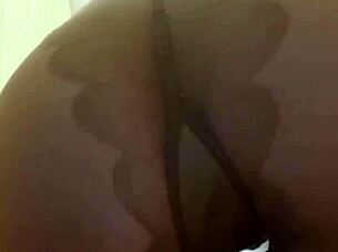 Mistress Elza Koms teases nylon-clad ass dominantly