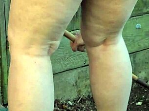 wife relaxes in garden unaware of secret outdoor filming