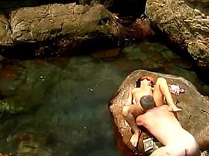 A horny mature guy pounds exotic babe in cap and shades on seaside rocks 💦👓