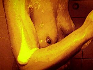 Seductive slow motion shower reveals wet glistening curves