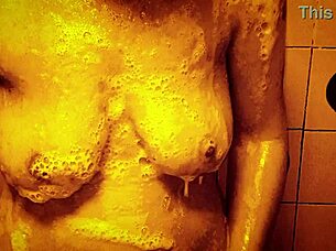 Seductive slow motion shower reveals wet glistening curves