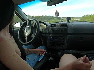 Girlfriend gives hot public road handjob in car to boyfriend's big cock outdoors