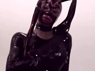 ebony shemale struts in latex craving monster cock action