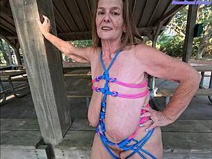 Curvy granny flashes saggy tits outdoors teasing