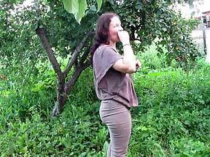 mature milf soaks jeans pissing in public garden fetish