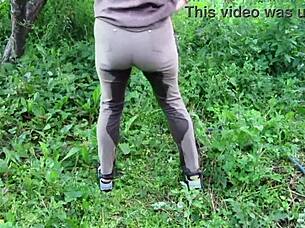 mature milf soaks jeans pissing in public garden fetish