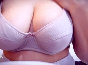 Cutie plays with her huge natural tits up close