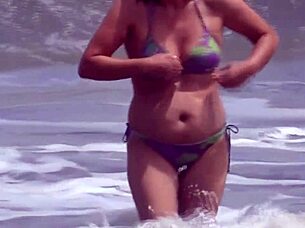 beach milf masturbates eyeing huge cock nearby