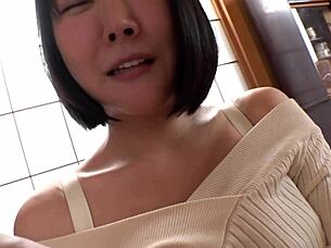 beautiful busty japanese milf shows off her huge natural tits in bed