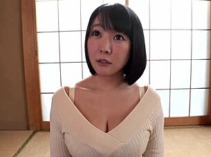beautiful busty japanese milf shows off her huge natural tits in bed
