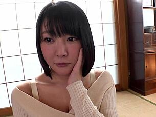 beautiful busty japanese milf shows off her huge natural tits in bed