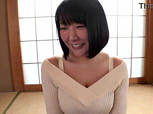 beautiful busty japanese milf shows off her huge natural tits in bed