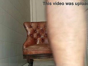 Big dick guy hauls armchair to bathroom for monster cock stroke session