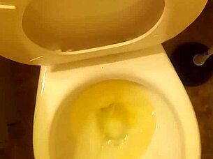 Young cock pissing in toilet tease?